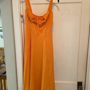 Orange midi dress with bow in the front
